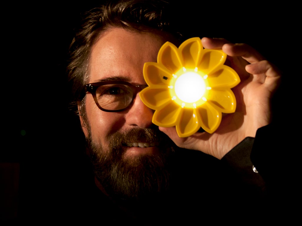 Olafur Eliasson with a "Little Sun" lamp