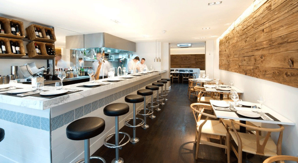 Donostia has a no-frills, canteen look: a long white train carriage of a room, minimally designed with a stark rectangle of untreated wood as a nod to rustic authenticity