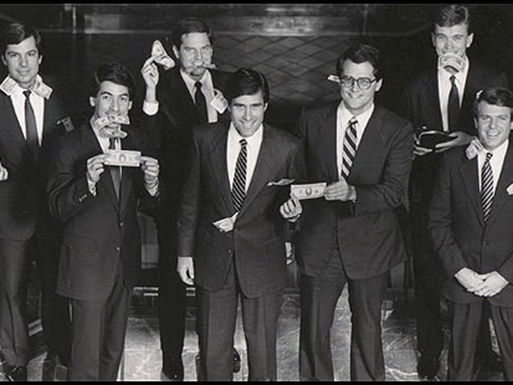 Mitt Romney, 3rd from left, poses with other partners at Bain Capital during his tenure at the firm. He has been accused of staying on at Bain for three years longer than his claimed departure date