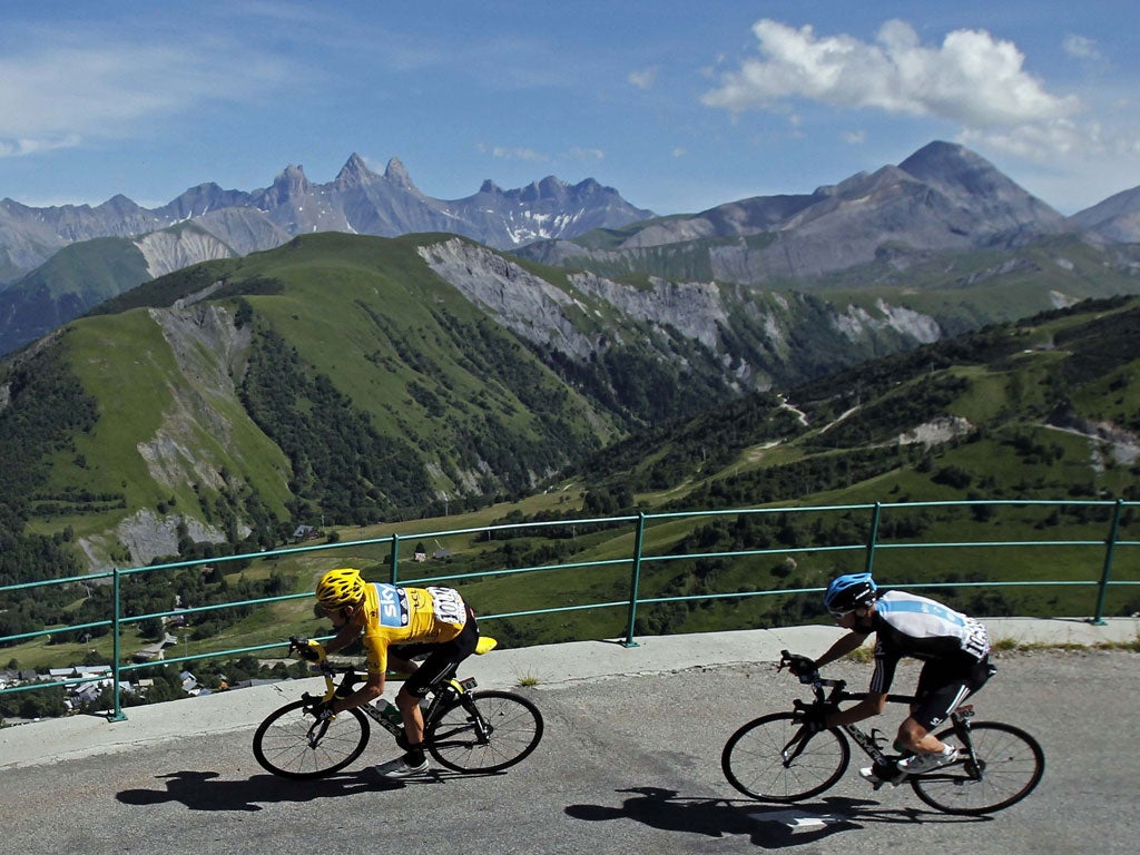 Bradley Wiggins (left) and Chris Froome in the Alps on yesterday's 11th stage