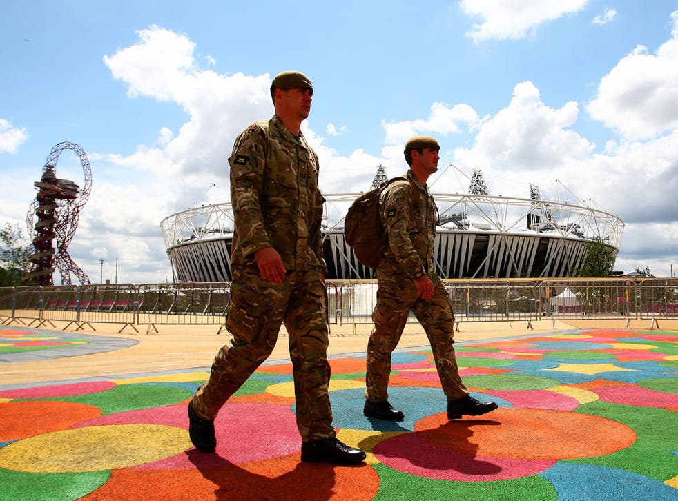Forces personnel patrol the Olympic Park in east London yesterday