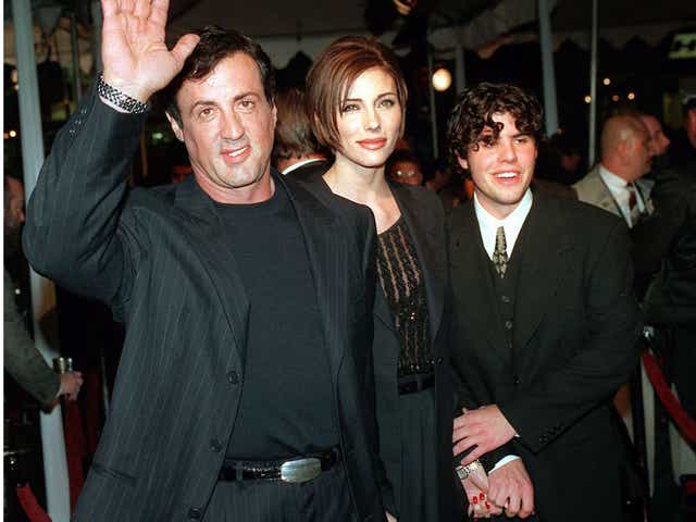 Father and son: Stallone arrives at a 1996 film premier with girlfriend Jennifer Flavin, center, and his son Sage