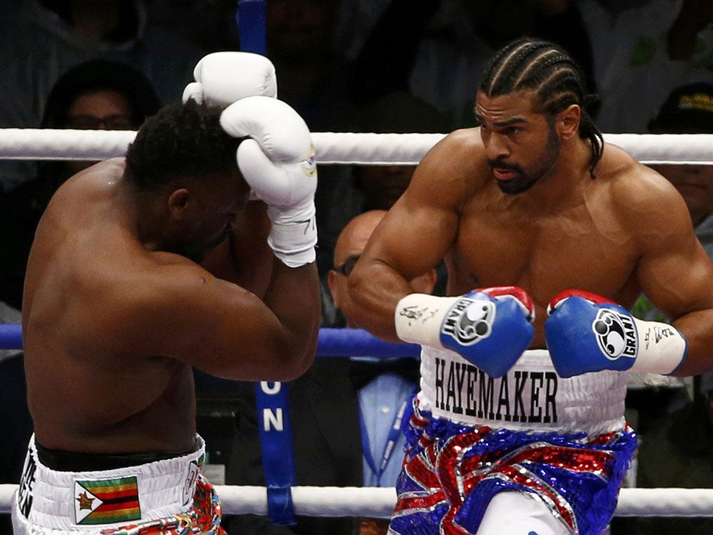 David Haye and Dereck Chisora exchange blows during their fight for the WBO and WBA International Heavyweight Championship