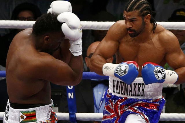 David Haye and Dereck Chisora exchange blows during their fight for the WBO and WBA International Heavyweight Championship