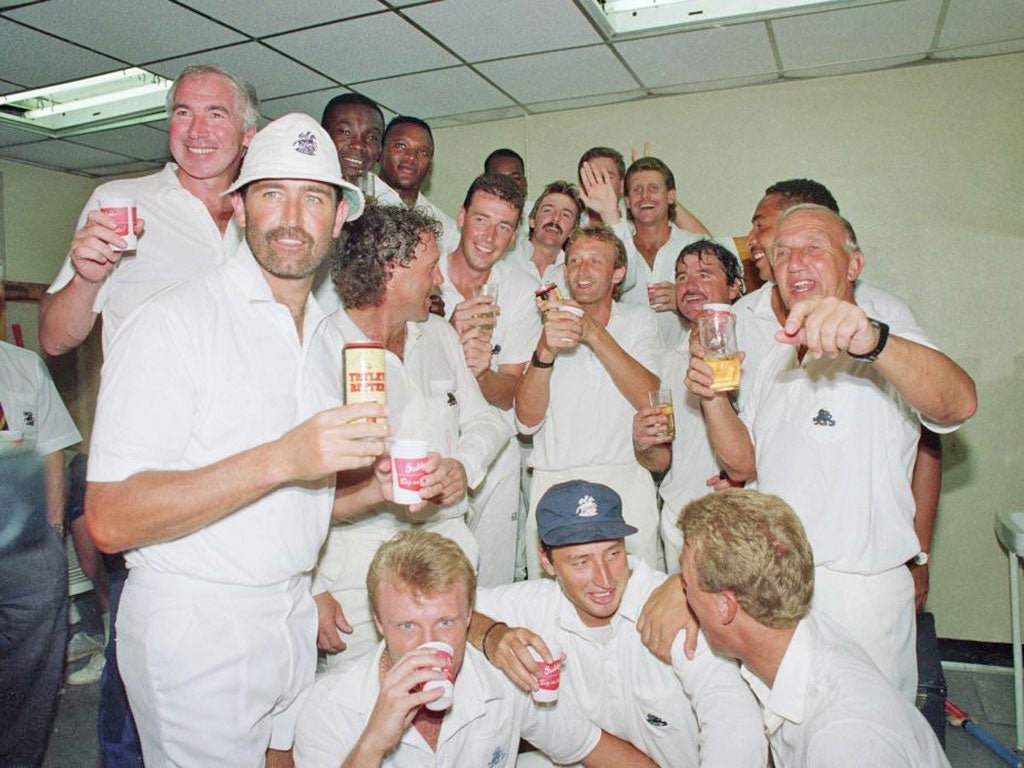 England’s victorious team, with Micky Stewart on the right, celebrate their historic triumph at Sabina Park in 1990