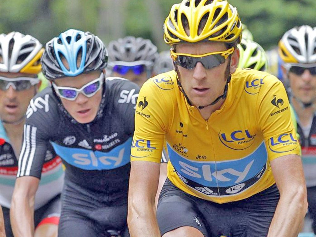 Bradley Wiggins wears the leader’s yellow jersey alongside Sky
team-mate Chris Froome