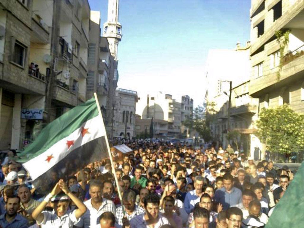 People take the streets in Damascus after an assault by forces loyal to President Assad