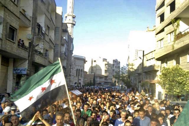 People take the streets in Damascus after an assault by forces loyal to President Assad