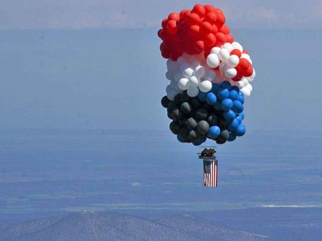 Oregon gas station owner Kent Couch and Iraqi adventurer Fareed Lafta lift off as they attempt to fly some 360 miles to Montana