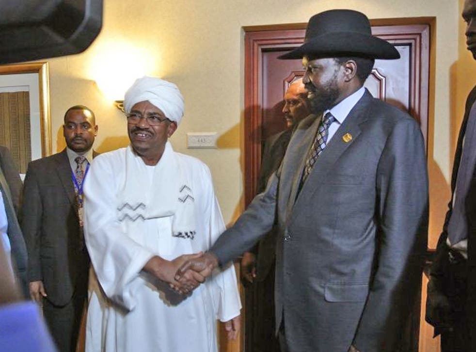 Sudanese President Omar al-Bashir (left) shakes hands with his South Sudanese counterpart Salva Kiir (right) following a meeting in the Ethiopian capital Addis Ababa