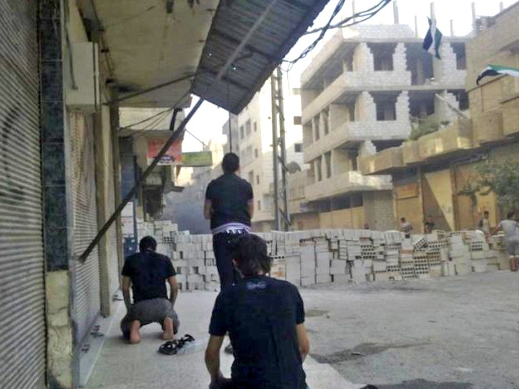 Anti-government protesters block roads close to the centre of Damascus