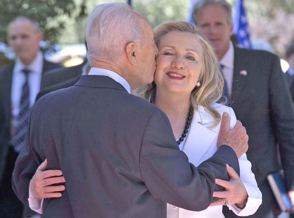 Israeli President Shimon Peres greets Hillary Clinton yesterday