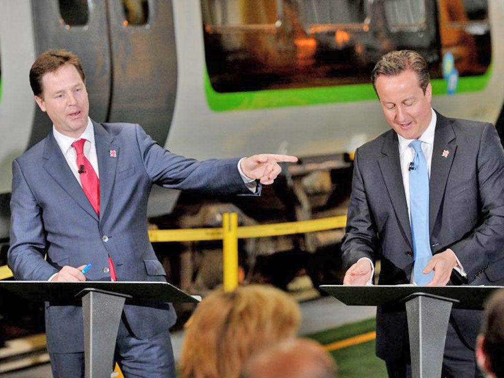David Cameron and Nick Clegg unveil the finer points of their rail
upgrade plan at London Midland railway’s depot in Smethwick
yesterday