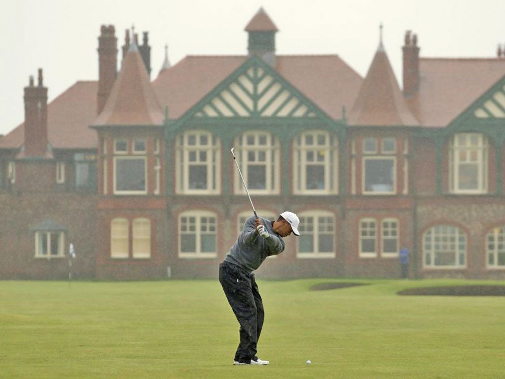 Tiger Wood's soggy start as the heavens open