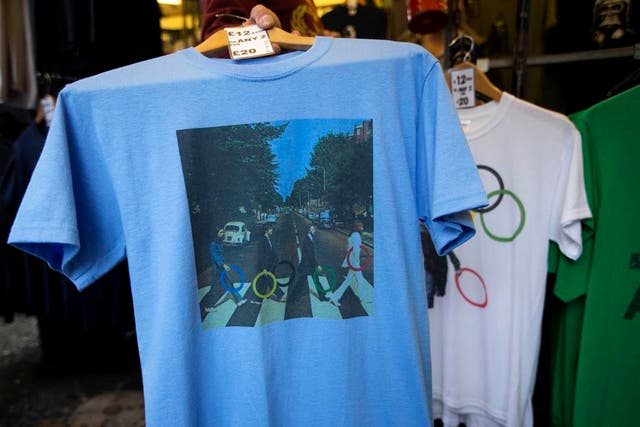 A t-shirt with featuring the cover photograph from the album "Abbey Road" printed on it, shows The Beatles holding Olympic rings as they walk across the zebra crossing as it sold at a London market. The guardians of the games are vigilant about protecting