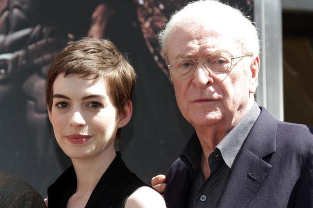 Michael Caine revisiting Batman's Alfred: pictured with Cat Woman Anne Hathaway