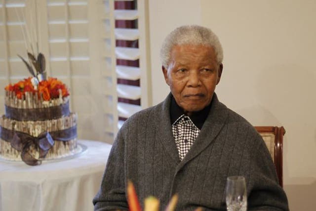 Nelson Mandela looks celebrates his birthday at his house in Eastern Cape with giant cakes and mass renditions of 'Happy Birthday'