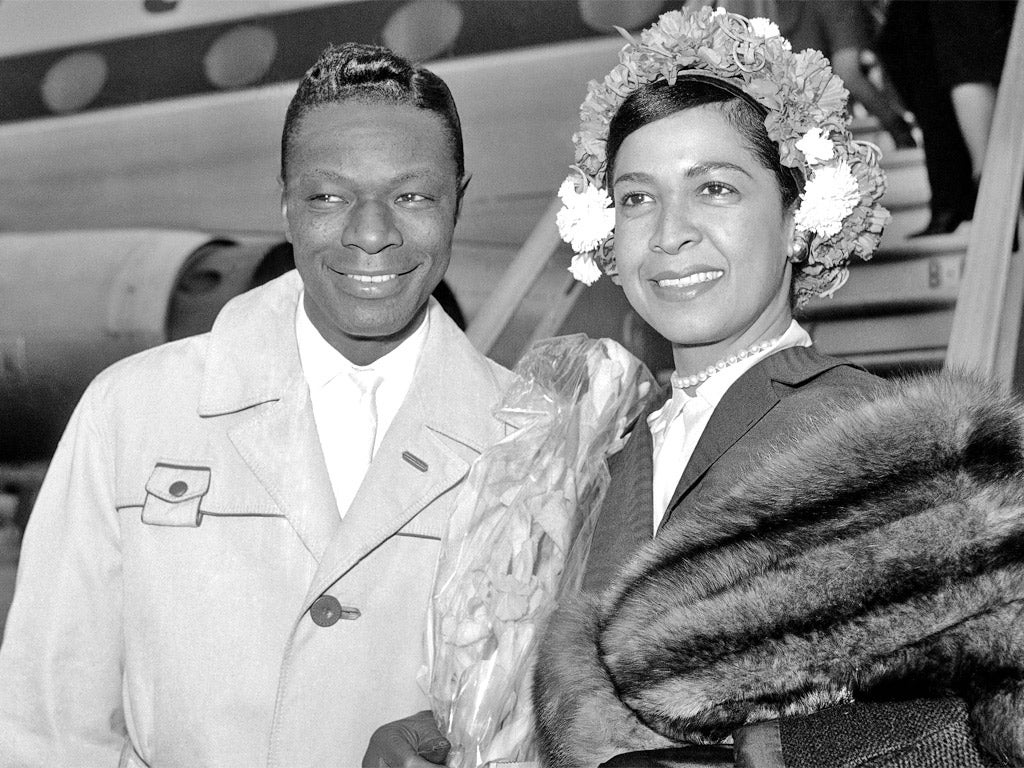 Cole with her husband Nat arriving in London in 1960