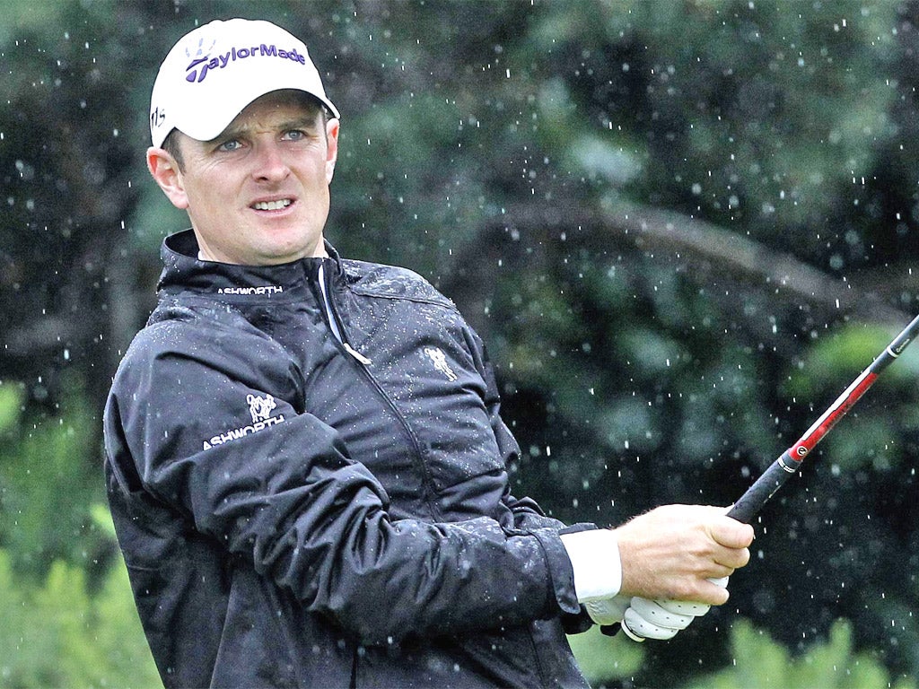 Justin Rose during a wet practice session yesterday