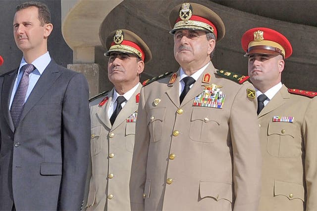 Senior regime figures reported to have been killed in yesterday’s blast in Damascus include Dawoud Rajha, Syria’s Defence Minister, shown, second from right, at a ceremony with President Assad last October