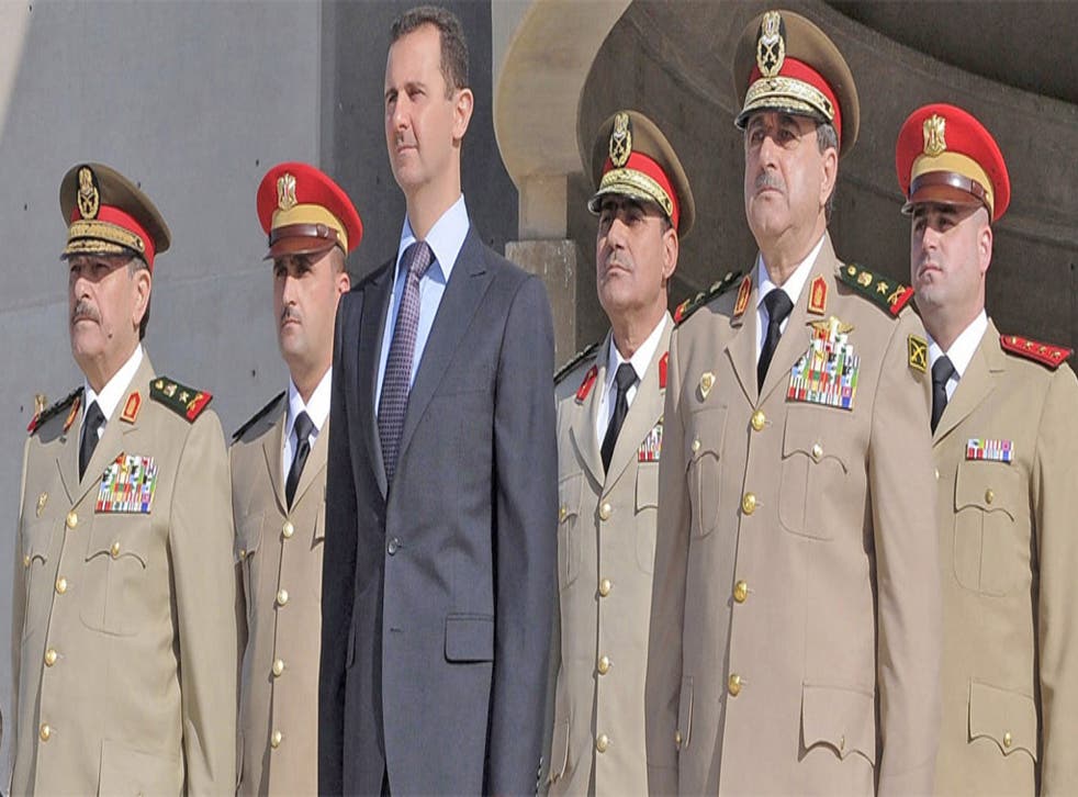 Senior regime figures reported to have been killed in yesterday’s blast in Damascus include Dawoud Rajha, Syria’s Defence Minister, shown, second from right, at a ceremony with President Assad last October