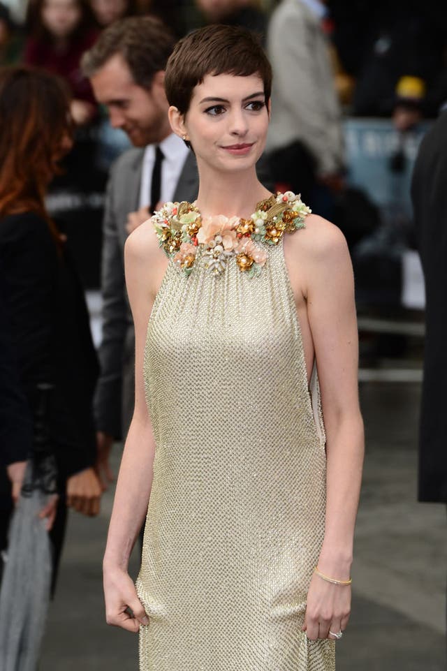 Cat Woman in gold at the Dark Knight Rises premiere in London