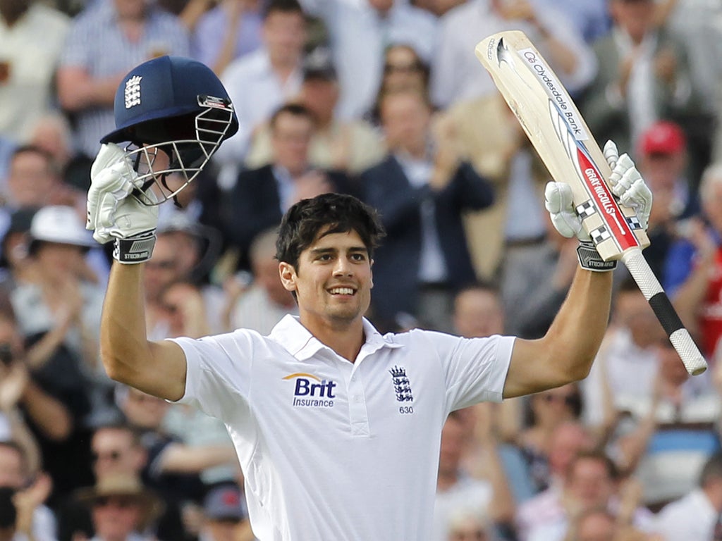 England's Alastair Cook celebrates after getting his century not out during day 1 of the first international Test cricket match between England and South Africa