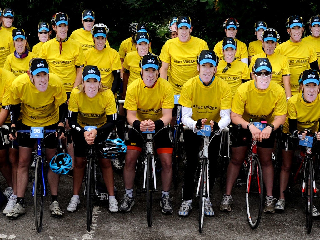 Amateur riders sport 'Wiggo' masks ahead of a 288-mile cycle ride between London and Paris to support Bradley Wiggins