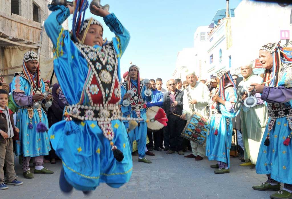 Members of a gnaoua troupe parade dance in Essaouira