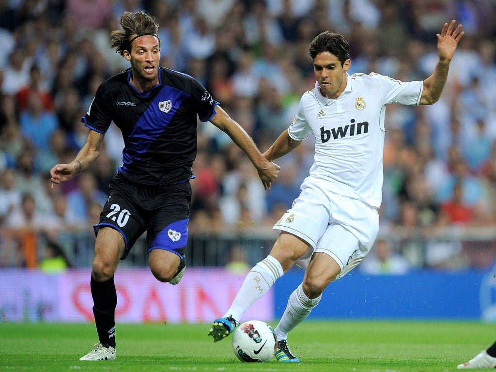 Michu (left) in action against Kaka
