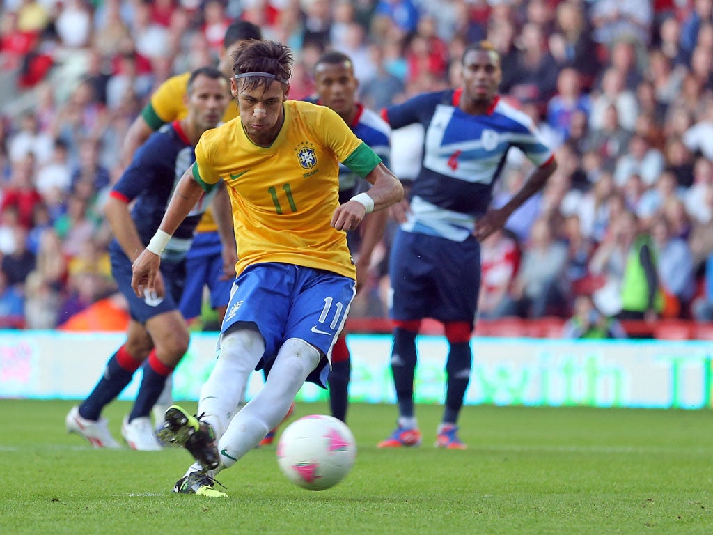 Neymar of Brazil scores
