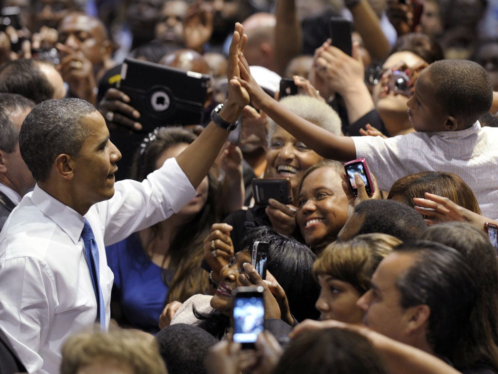 Barack Obama greets the crowd after a speech in Jacksonville, Florida