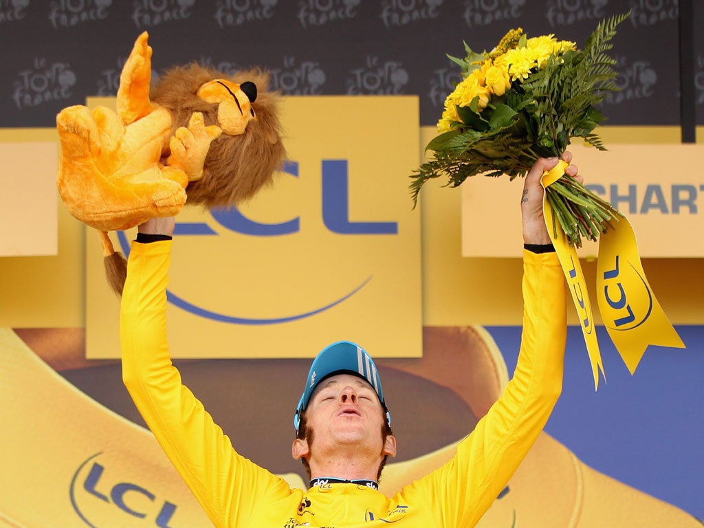 Bradley Wiggins celebrates on podium