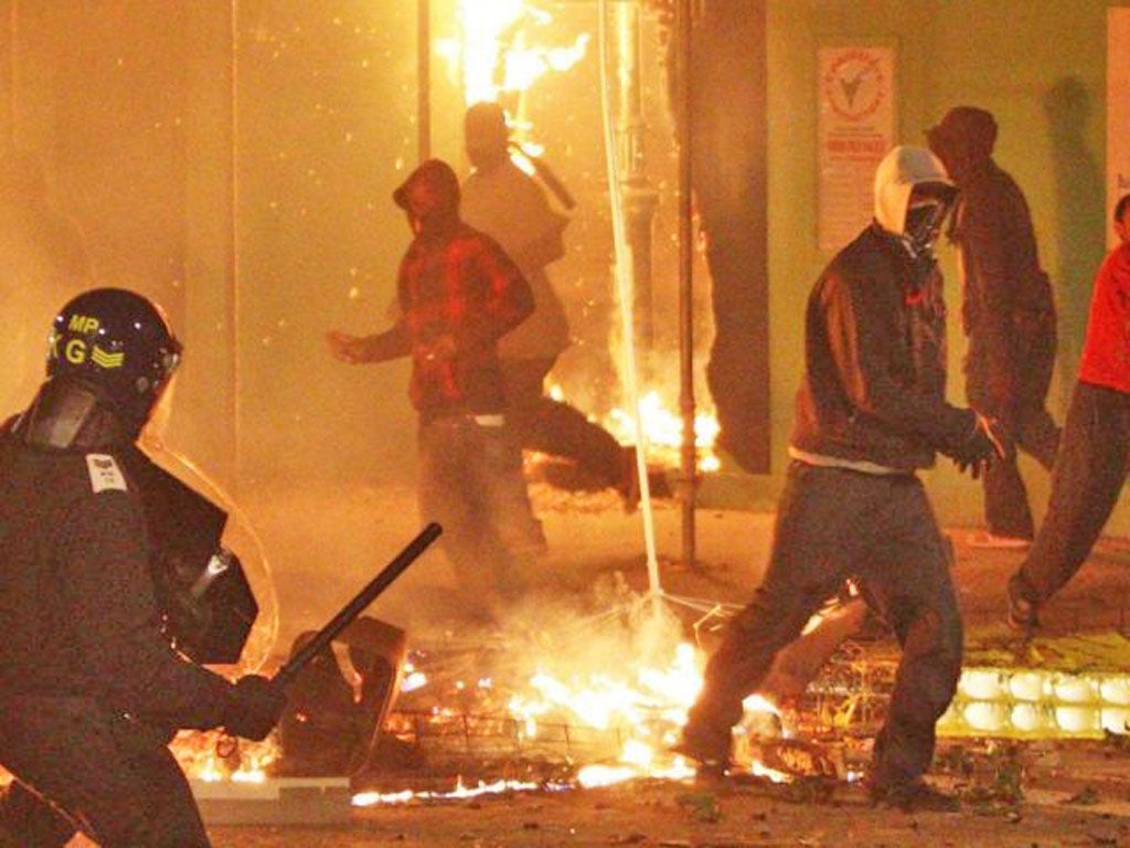 Cities hit by last summer's riots have fallen down a league table of the best places in the world for living conditions