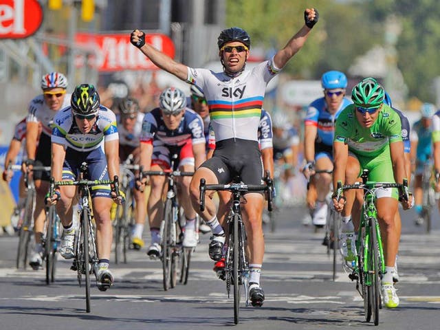 Mark Cavendish celebrates his fourth successive final-stage victory yesterday