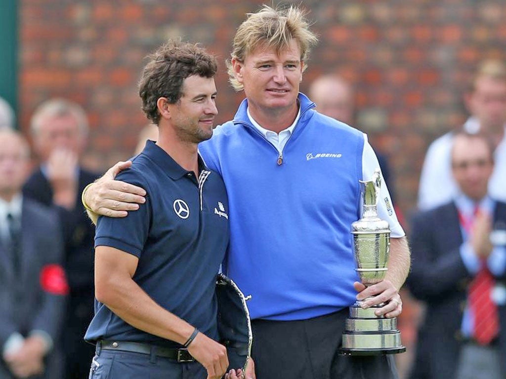 Adam Scott receives a consoling hug from the Open champion Ernie Els after the Australian’s Royal Lytham disaster