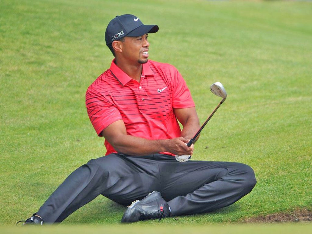 Shot of the day: Even 14-time major winners have to get down and dirty sometimes. Tiger Woods got on to all fours to escape a bunker at the sixth, en route to his first triple-bogey at a major in nine years