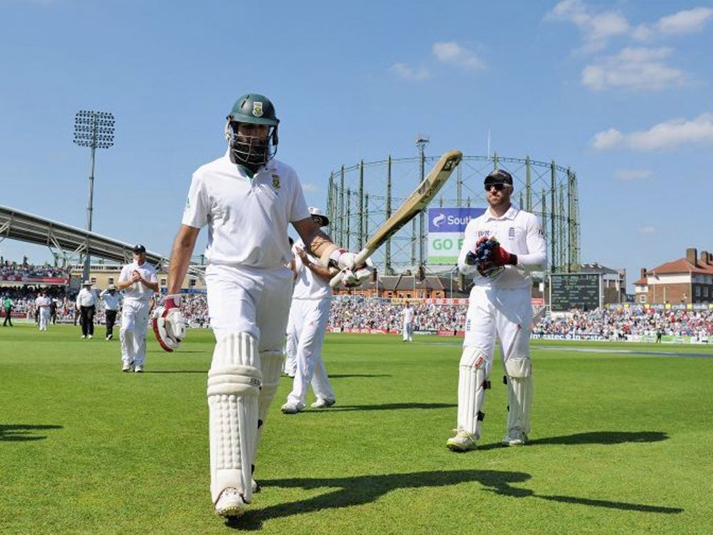 Hashim Amla, of South Africa, is applauded off the field after his
unbeaten 311