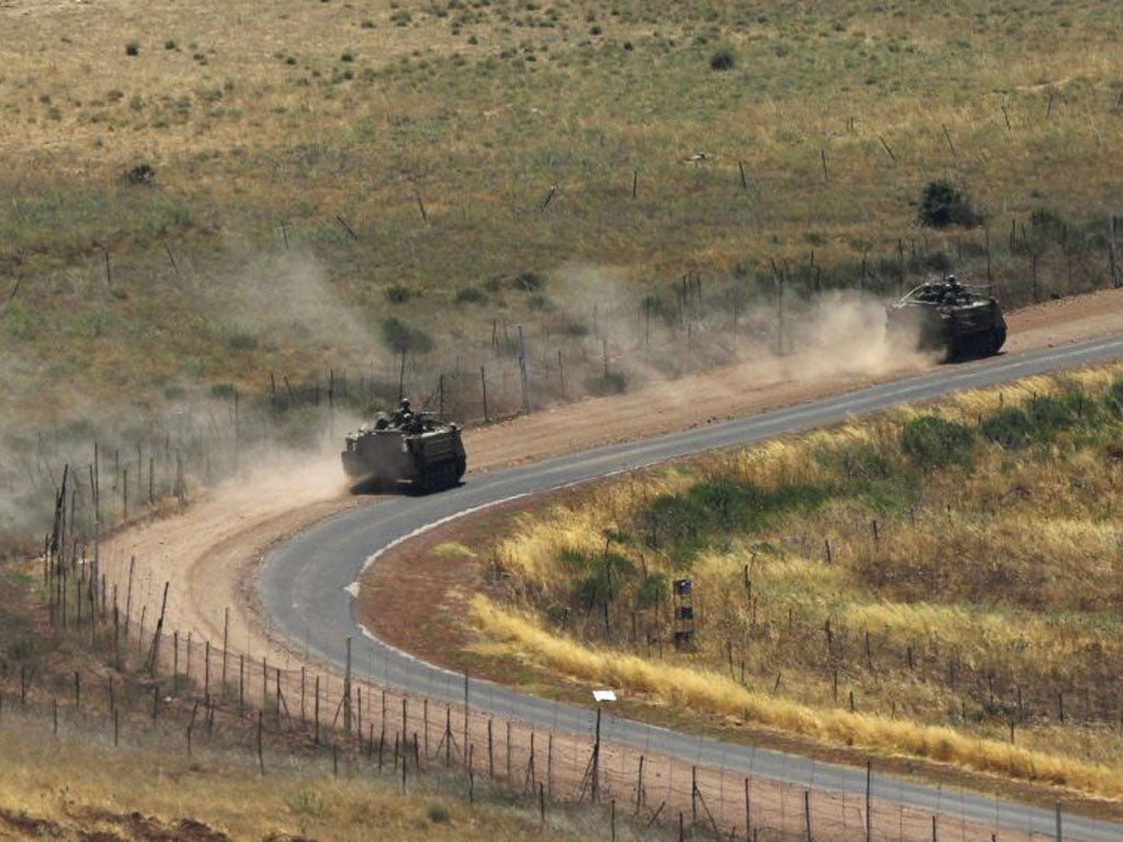 Israeli armoured personnel carriers (APC) drive along the Israeli-Syrian border. Israel has said it fears that chaos following president Bashar Assad's fall could allow the Jewish state's enemies to access Syria's chemical weapons, and has not ruled out military intervention.
