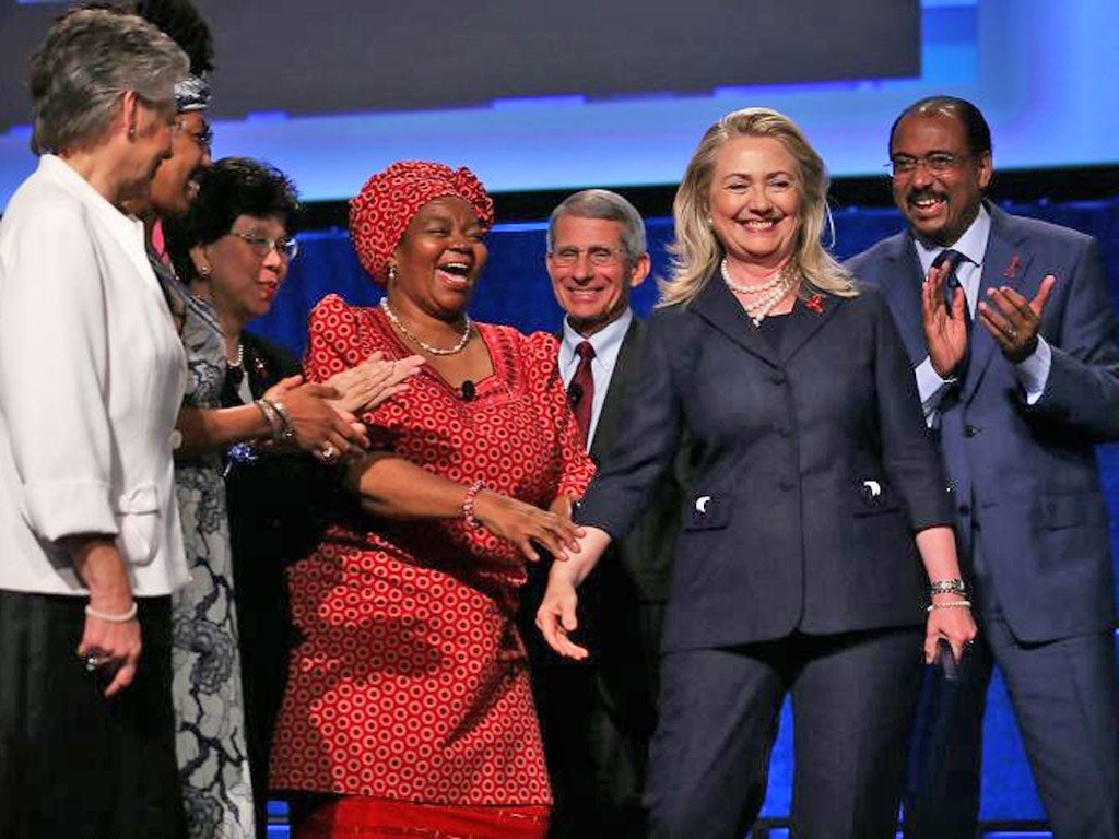 Hillary Clinton, after her speech yesterday, flanked by Michel Sidibé, right, Anthony Fauci, left