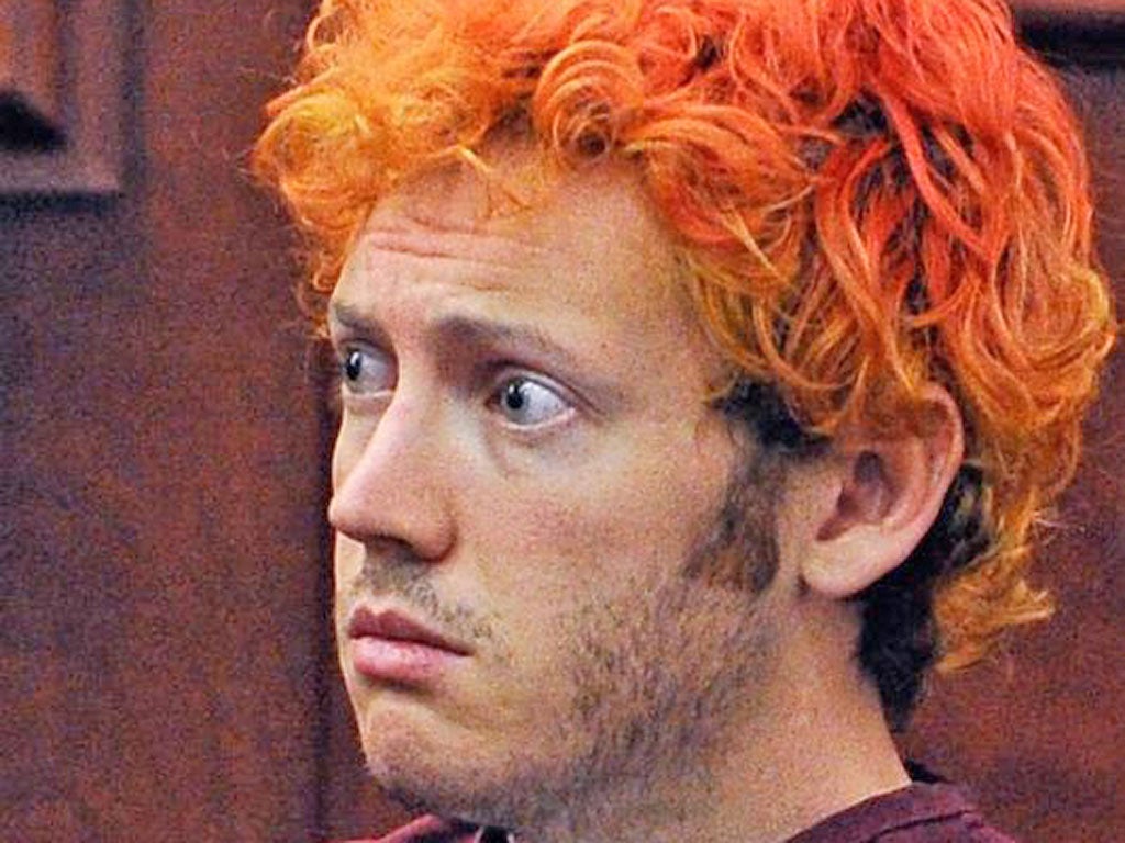 James Holmes, 24, seemed bleary and confused during his first 10-minute hearing in court yesterday