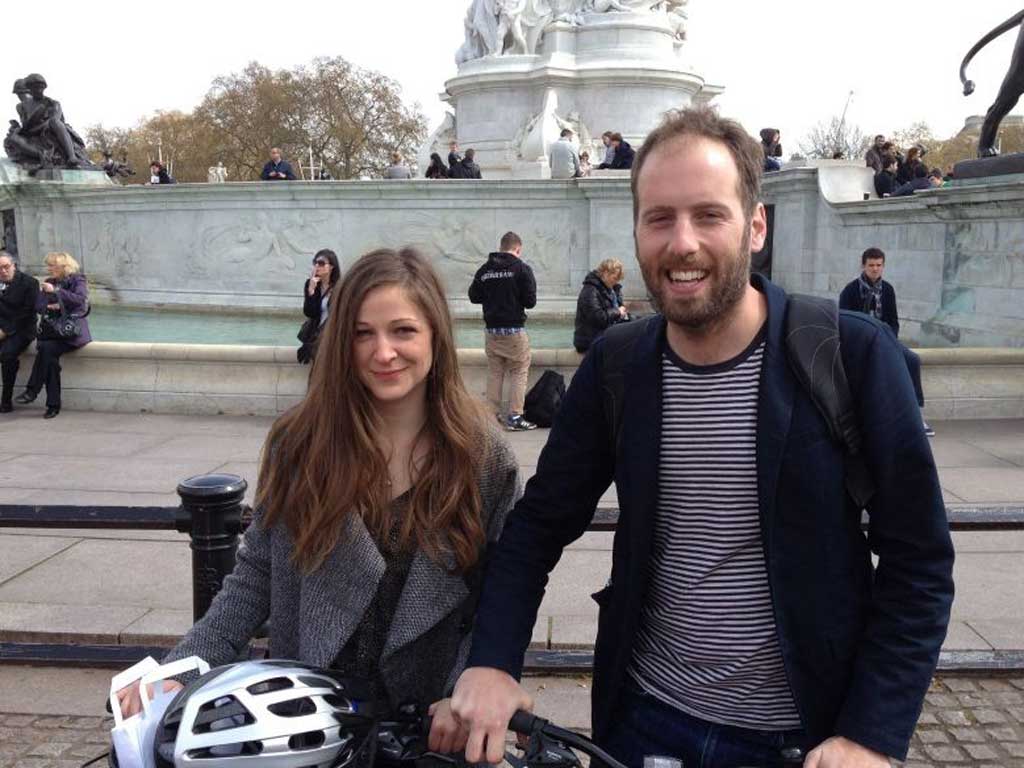 Simon outside Buckingham Palace with cycling partner Jess