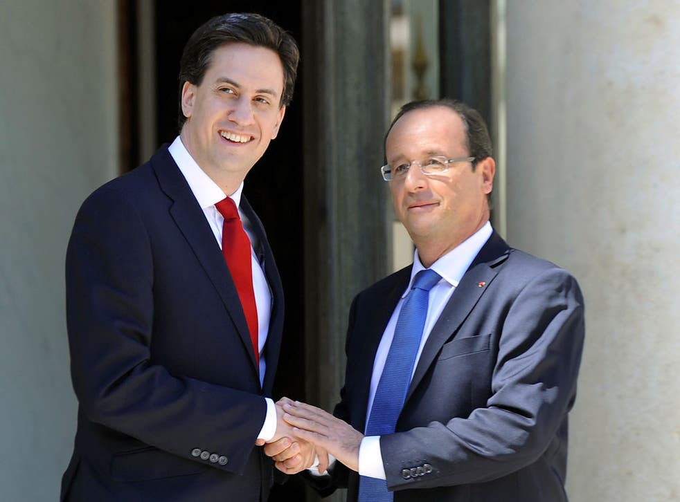 Hollande welcomes Miliband before a meeting at the Elysee Palace in Paris