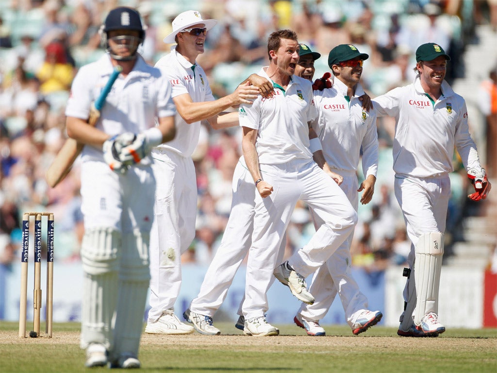 The South African players celebrate taking the wicket of Ian Bell