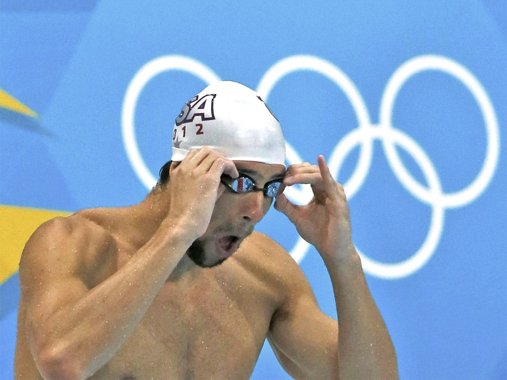 Michael Phelps trains at the Aquatics Centre yesterday