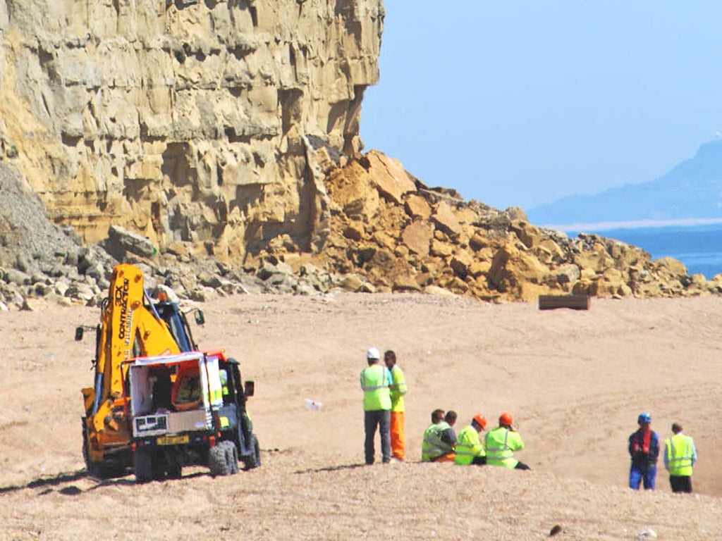 Around 400 tons of rock and mud fell on to the beach near Burton Bradstock