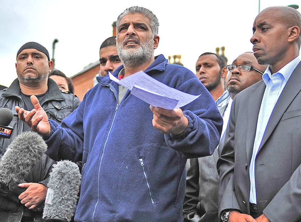 Tariq Jahan, centre, father of Haroon Jahan, who was hit and killed by a car with two other Asian men