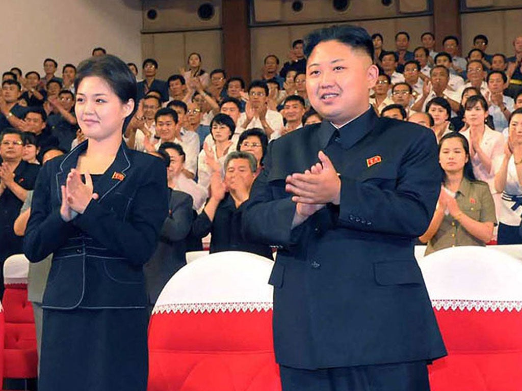 The mystery woman accompanying young leader Kim Jong-un to recent public events had been left unnamed until today
