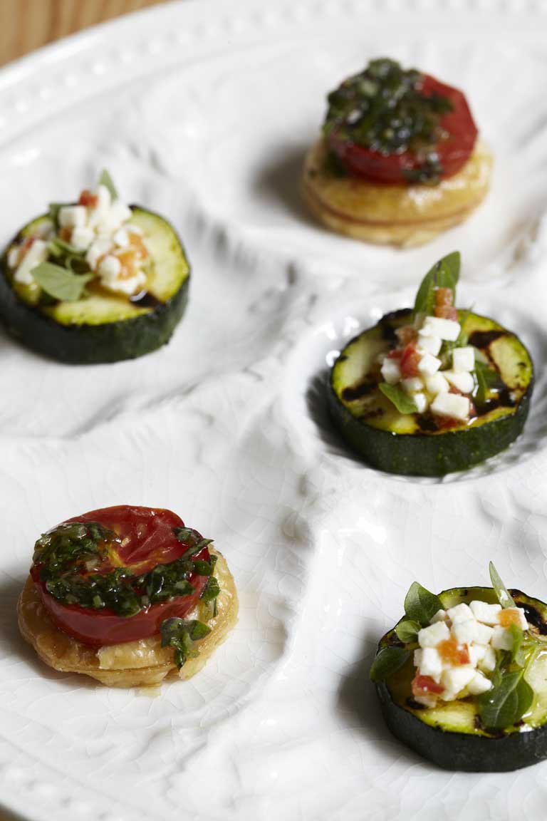 Tomato and basil tarts and courgette and feta tarts