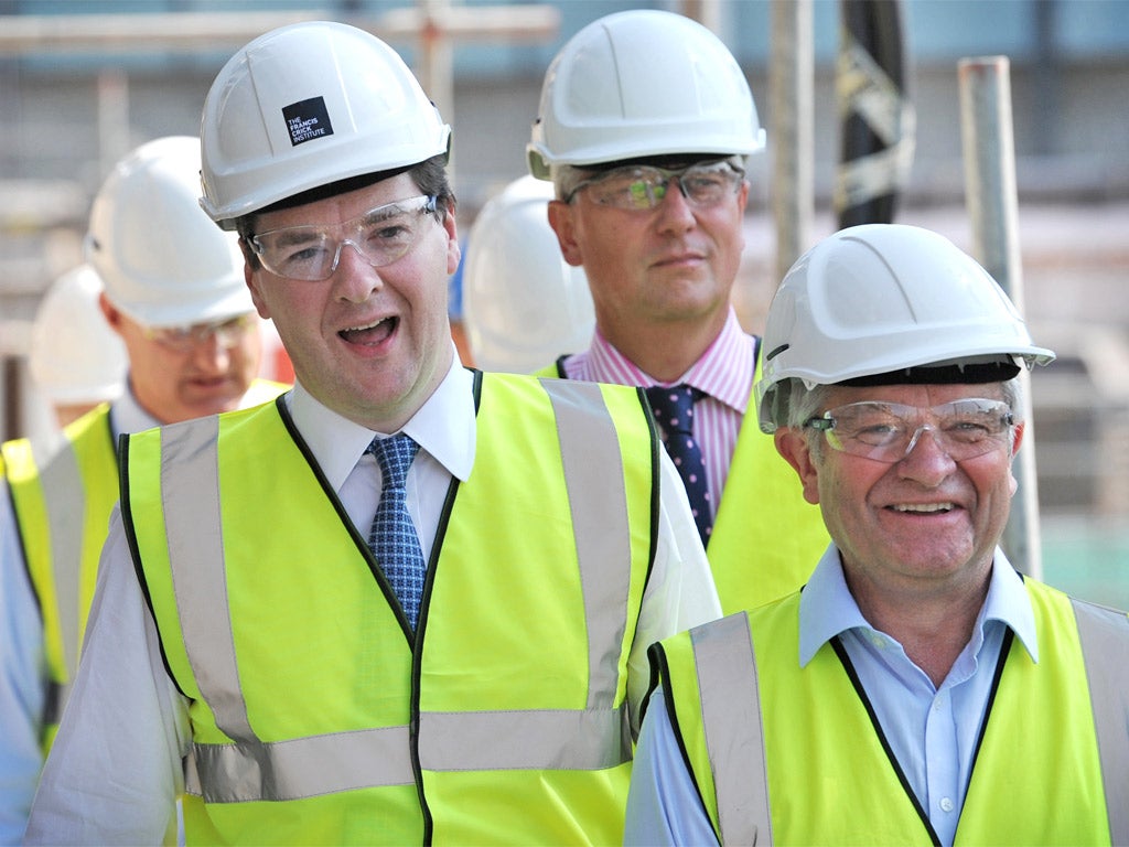 George Osborne visits a building site in London yesterday
